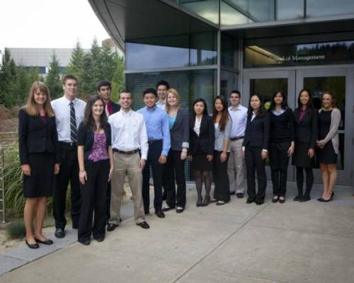 Students in front of The School of Management at Binghamton University, State University of New York.